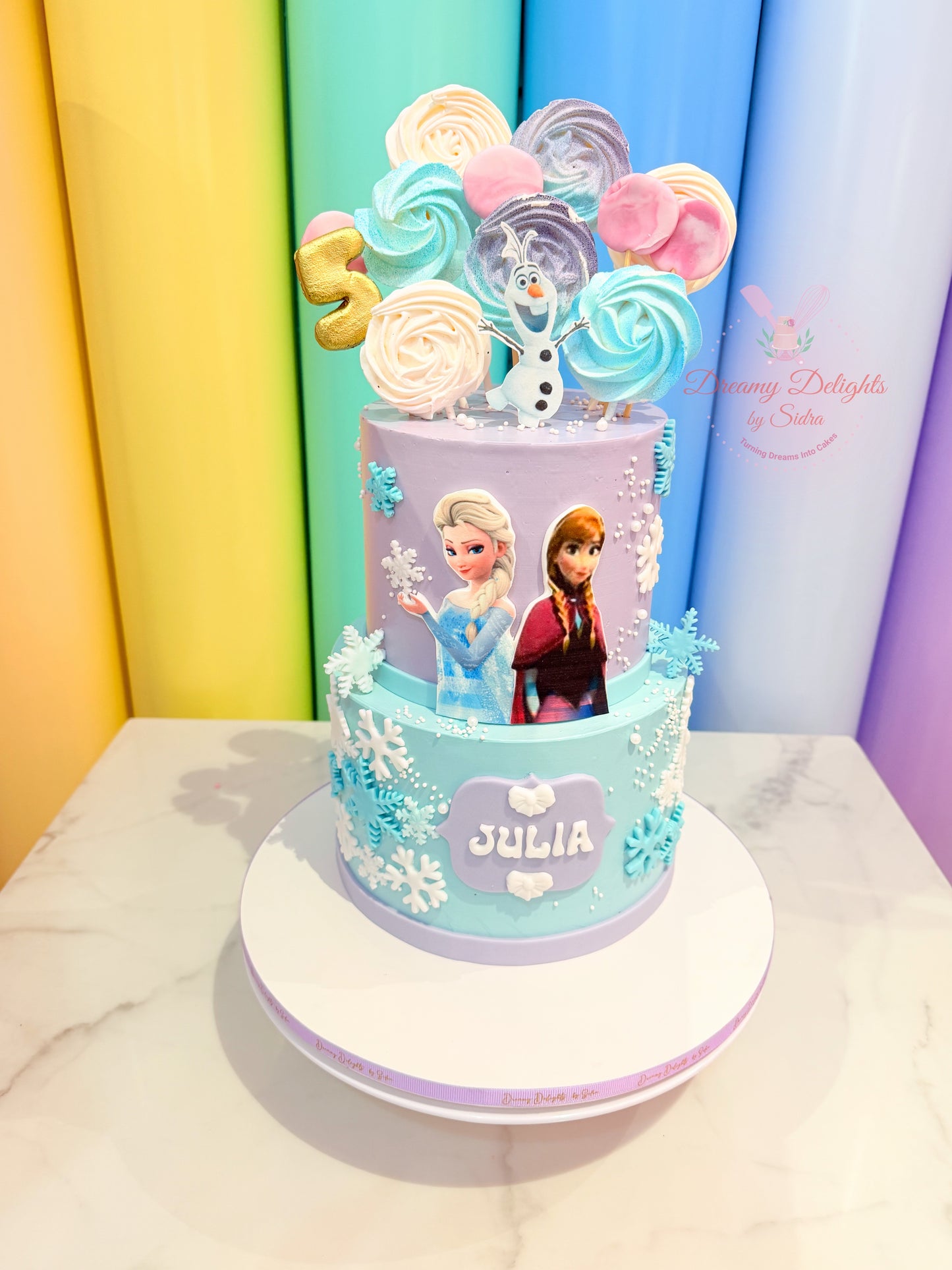 Elsa Anna Olaf Frozen birthday cake with snowflakes and custom name, kids birthday cake for girls in Dubai