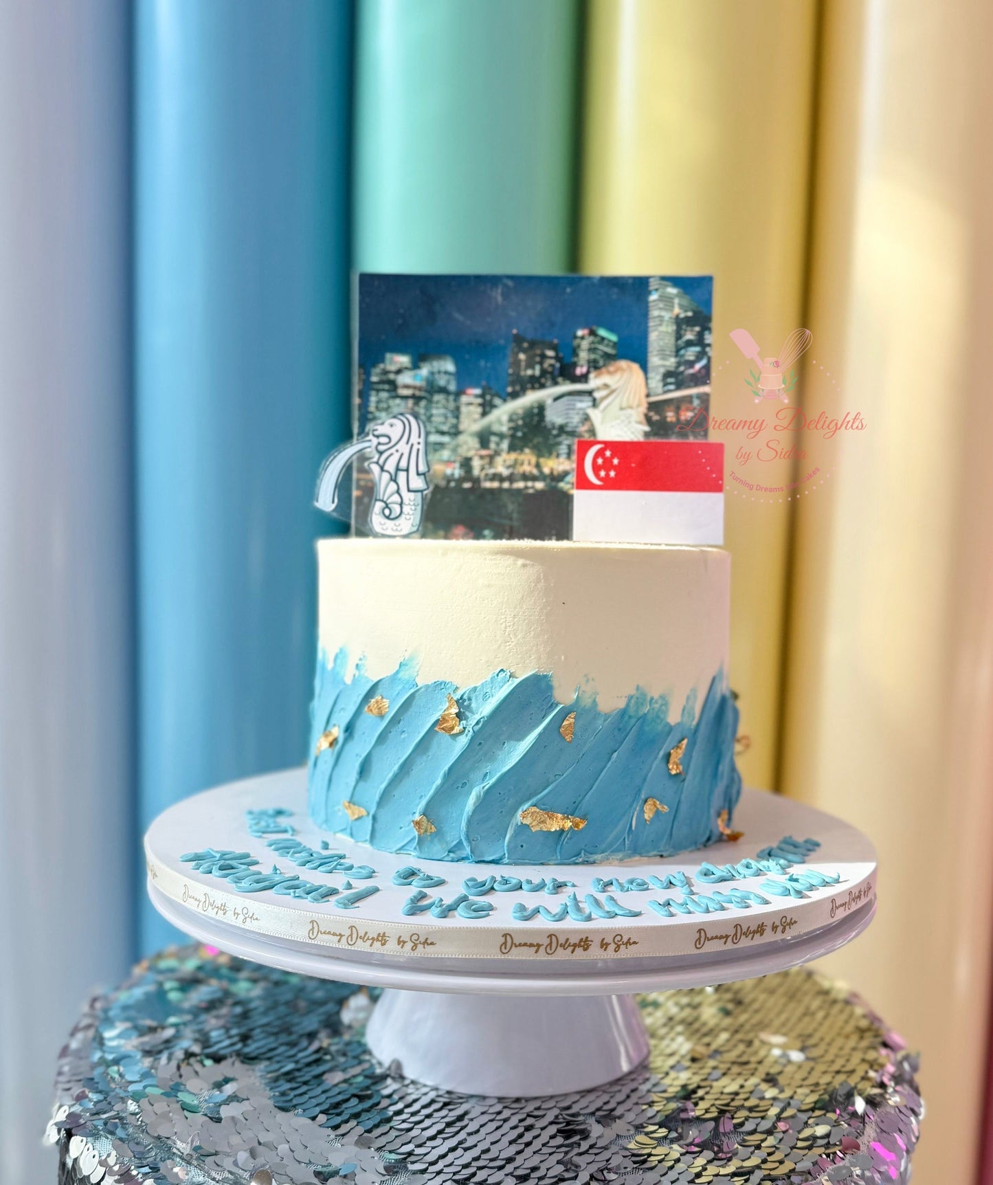 Farewell Singapore Cake with Singapore landmarks, flag, and travel-themed decorations in Dubai