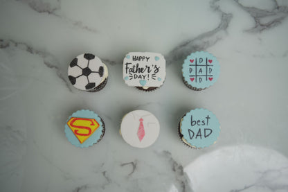 Father's Day cupcakes with football, superhero, tie, and Best Dad themed decorations for Father's Day 2026 celebrations in Dubai.