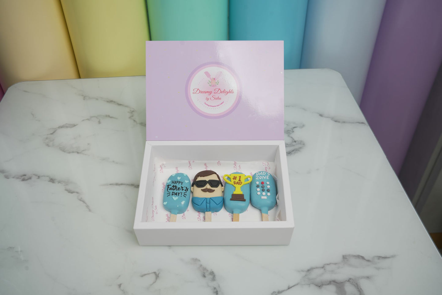 Father's Day Remote Cakesicles featuring dad-themed designs, trophy, remote control, and Father's Day decorations for Father's Day 2026 in Dubai