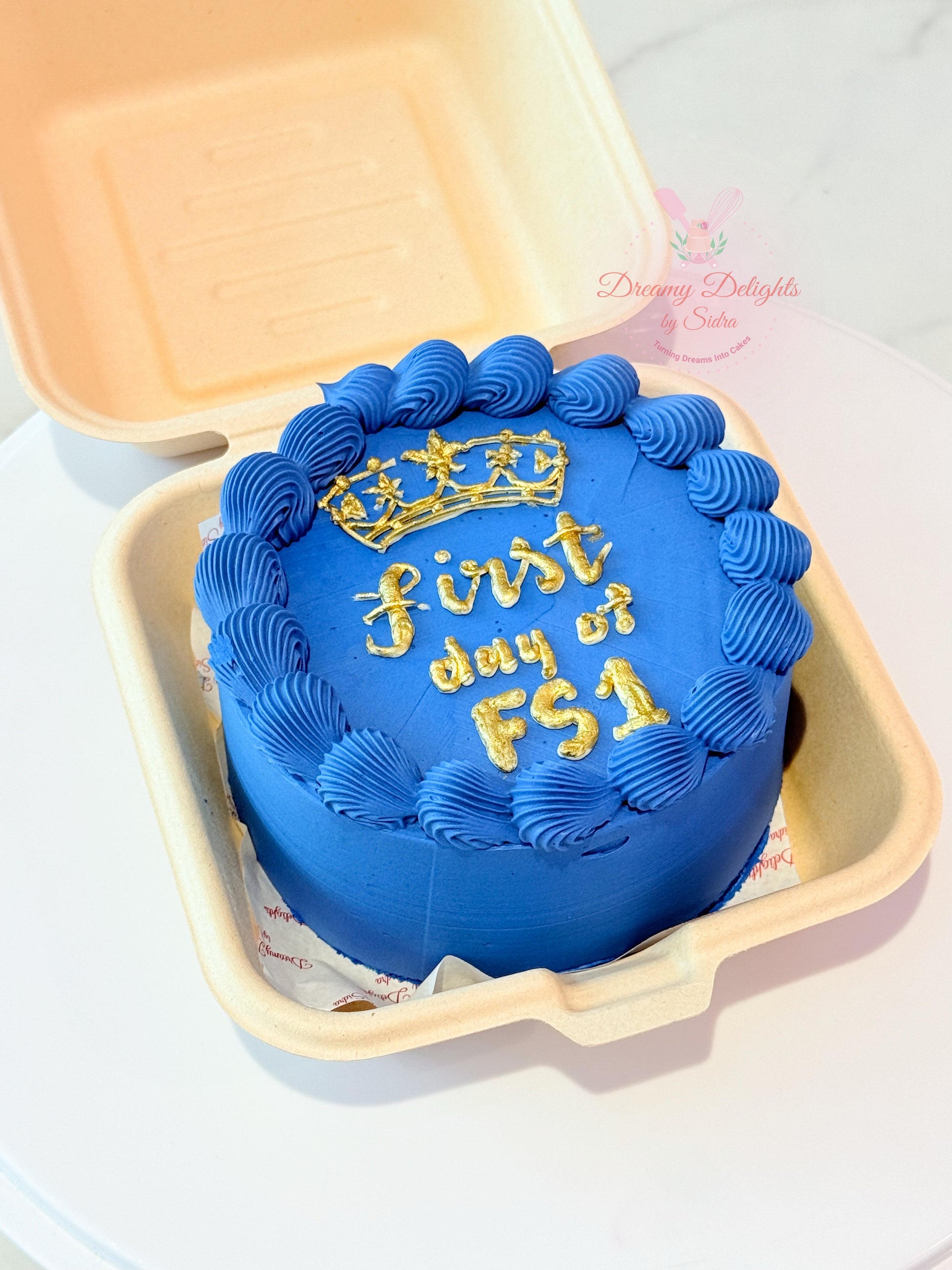 First day of school bento cake with blue buttercream frosting, school theme design and custom message by Dreamy Delights by Sidra in Dubai