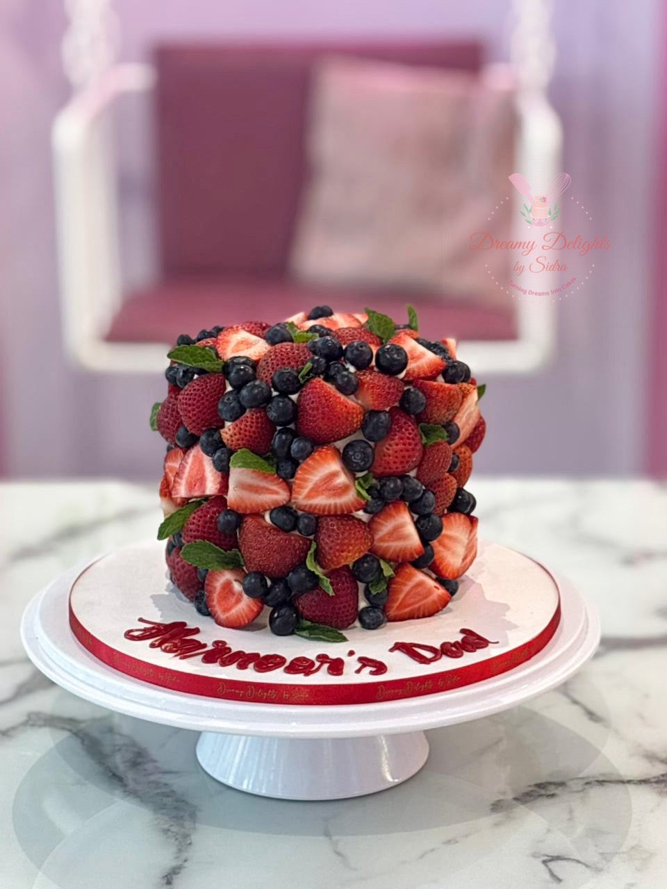Fresh Fruit Cake Dubai with strawberry and blueberry toppings, premium customized berry birthday cake for celebrations.