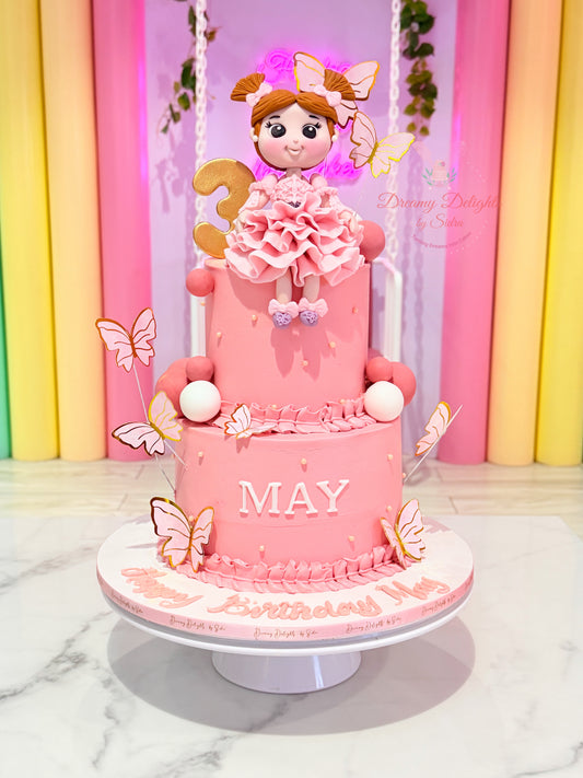Pastel butterfly birthday cake with doll topper for girls Dubai