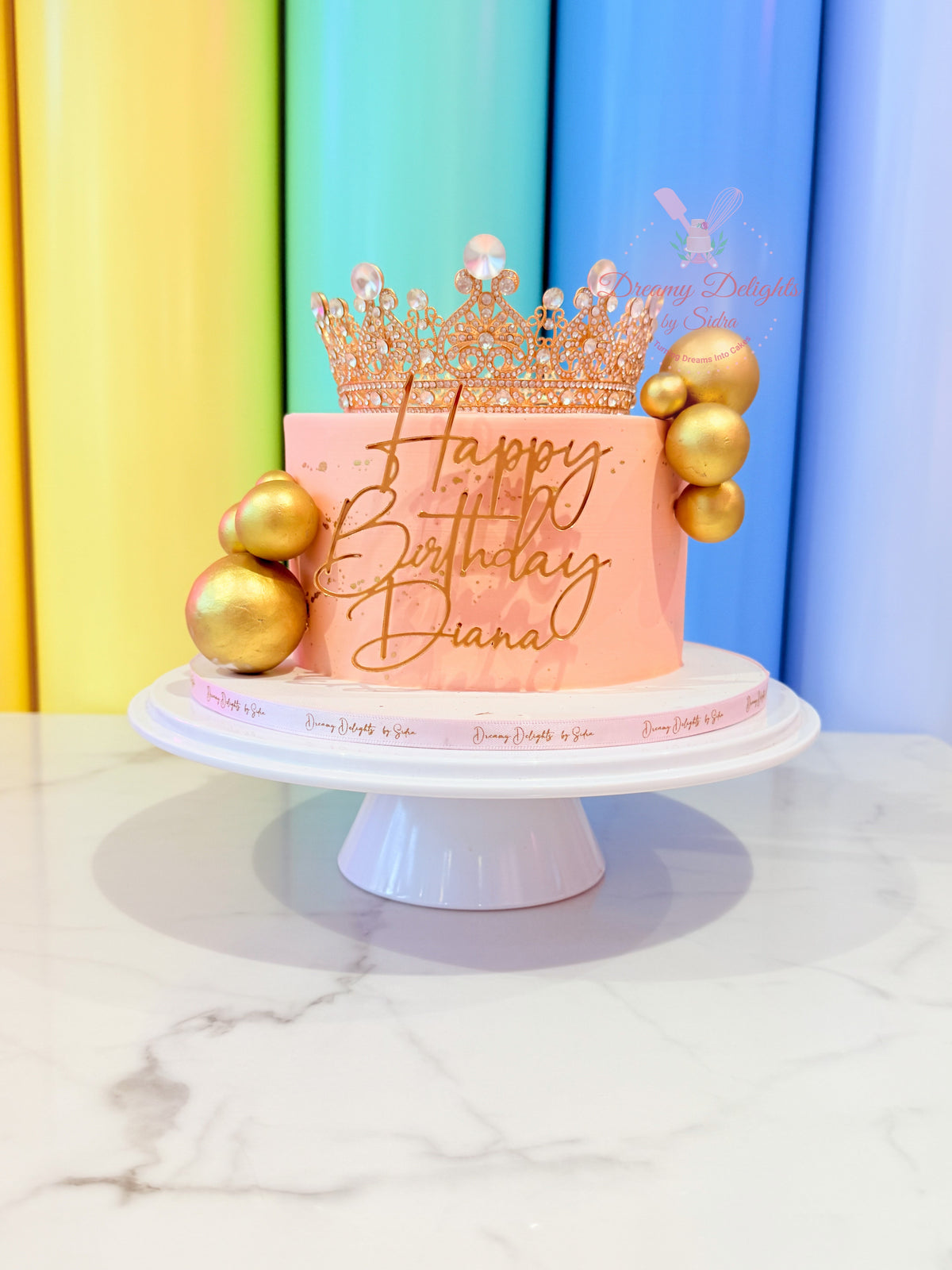Glitter crown luxury birthday cake with gold decorations for women birthday celebration in Dubai