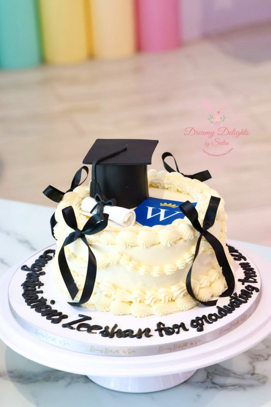 Graduation cake with fondant graduation cap, diploma scroll, and personalized decorations for school, college, and university graduation celebrations.