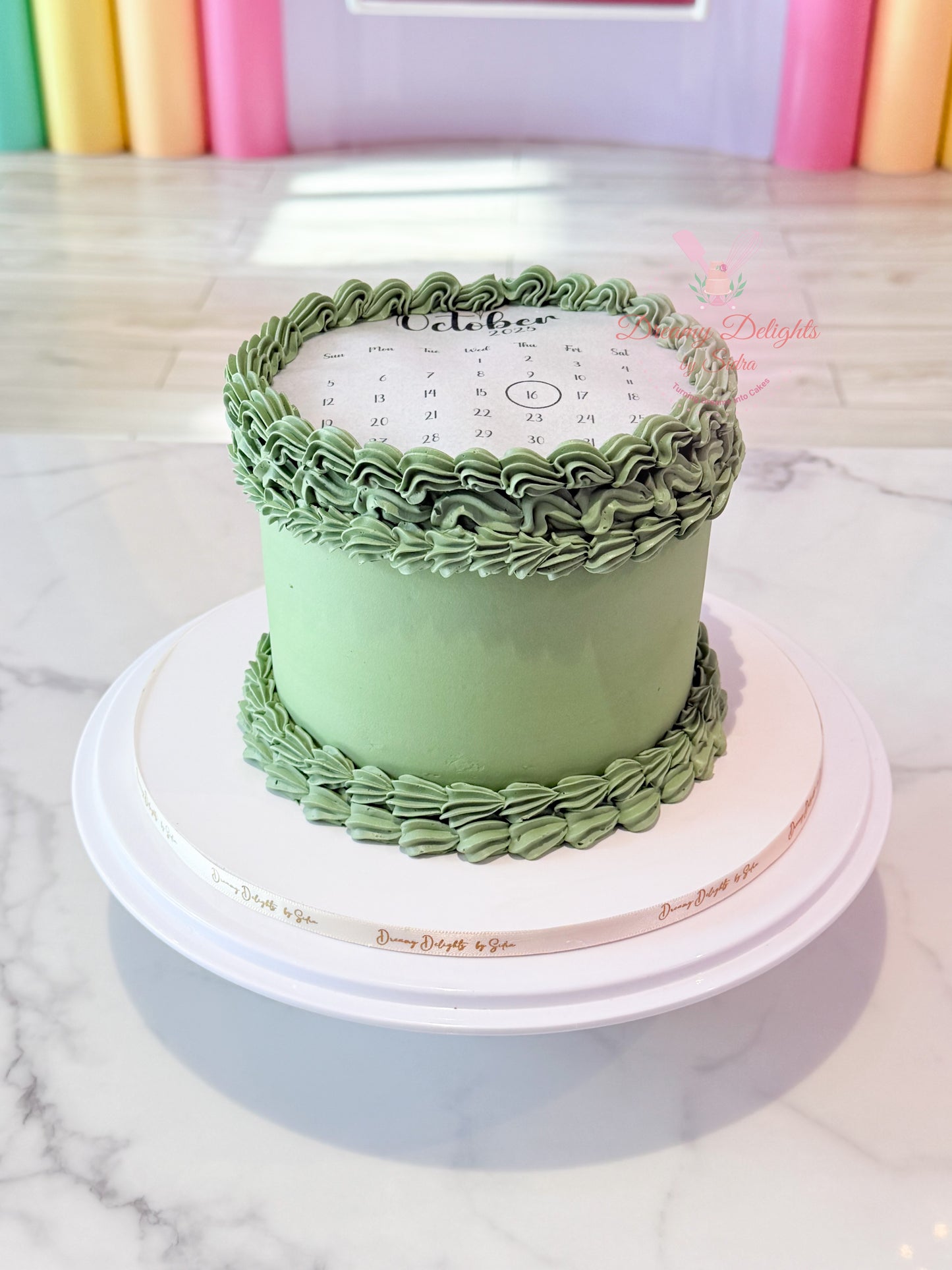 Green calendar burnaway cake with hidden image reveal and vintage buttercream piping in Dubai