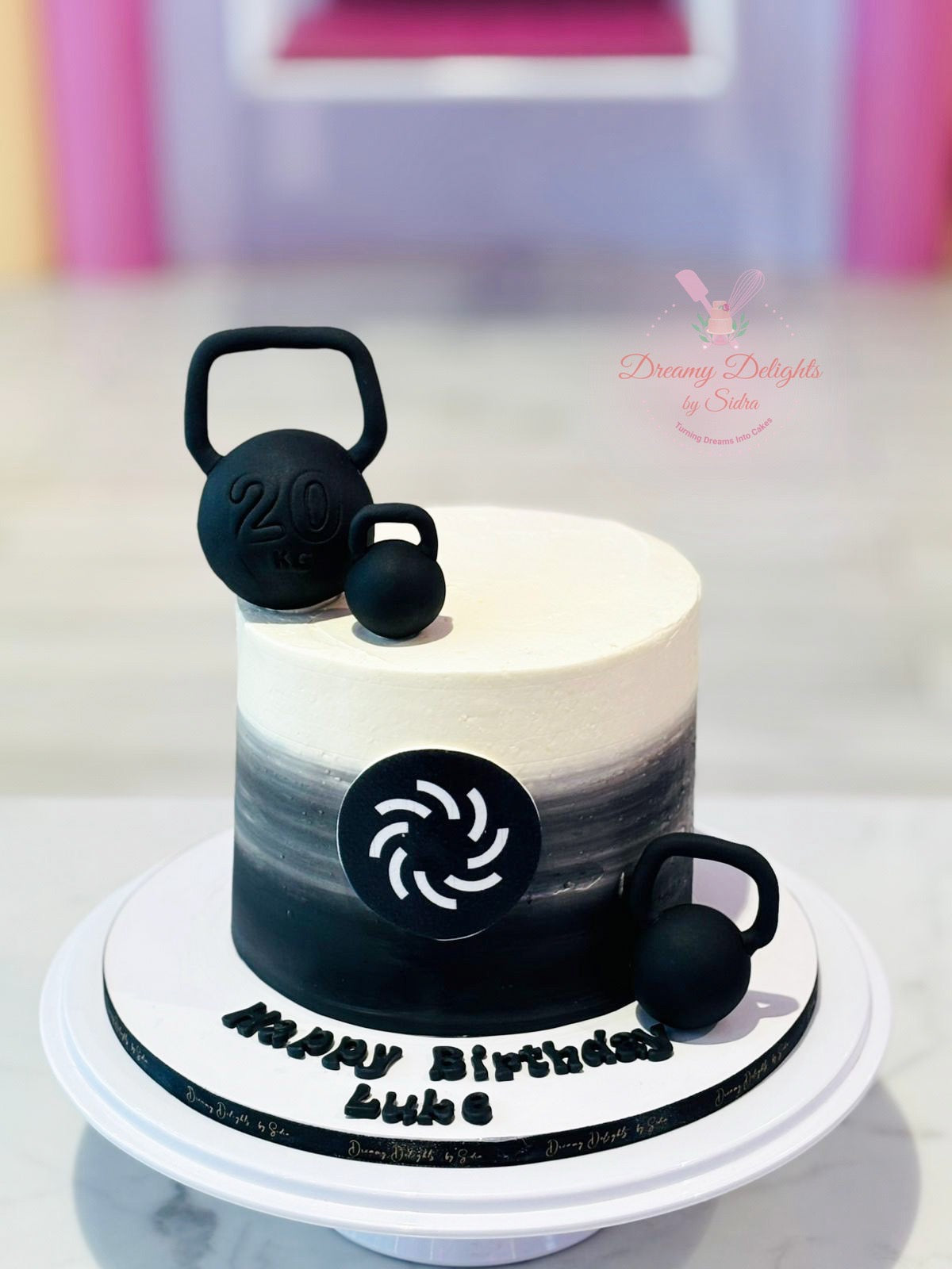 Gym birthday cake for him with kettlebell decorations handcrafted by Dreamy Delights by Sidra in Dubai.
