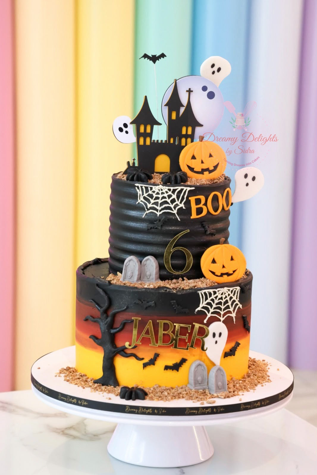 Boo Ghost Castle Halloween cake Dubai with pumpkins, ghosts, bats and spooky castle details by Dreamy Delights by Sidra

