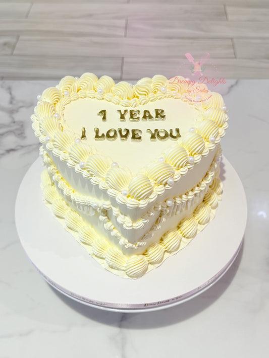 Vintage buttercream heart shaped birthday cake with retro piping and pearl decoration Dubai