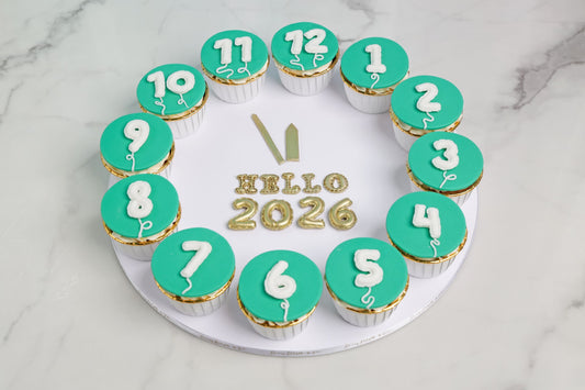 Hello 2026 balloon cupcakes arranged in a countdown circle by Dreamy Delight by Sidra