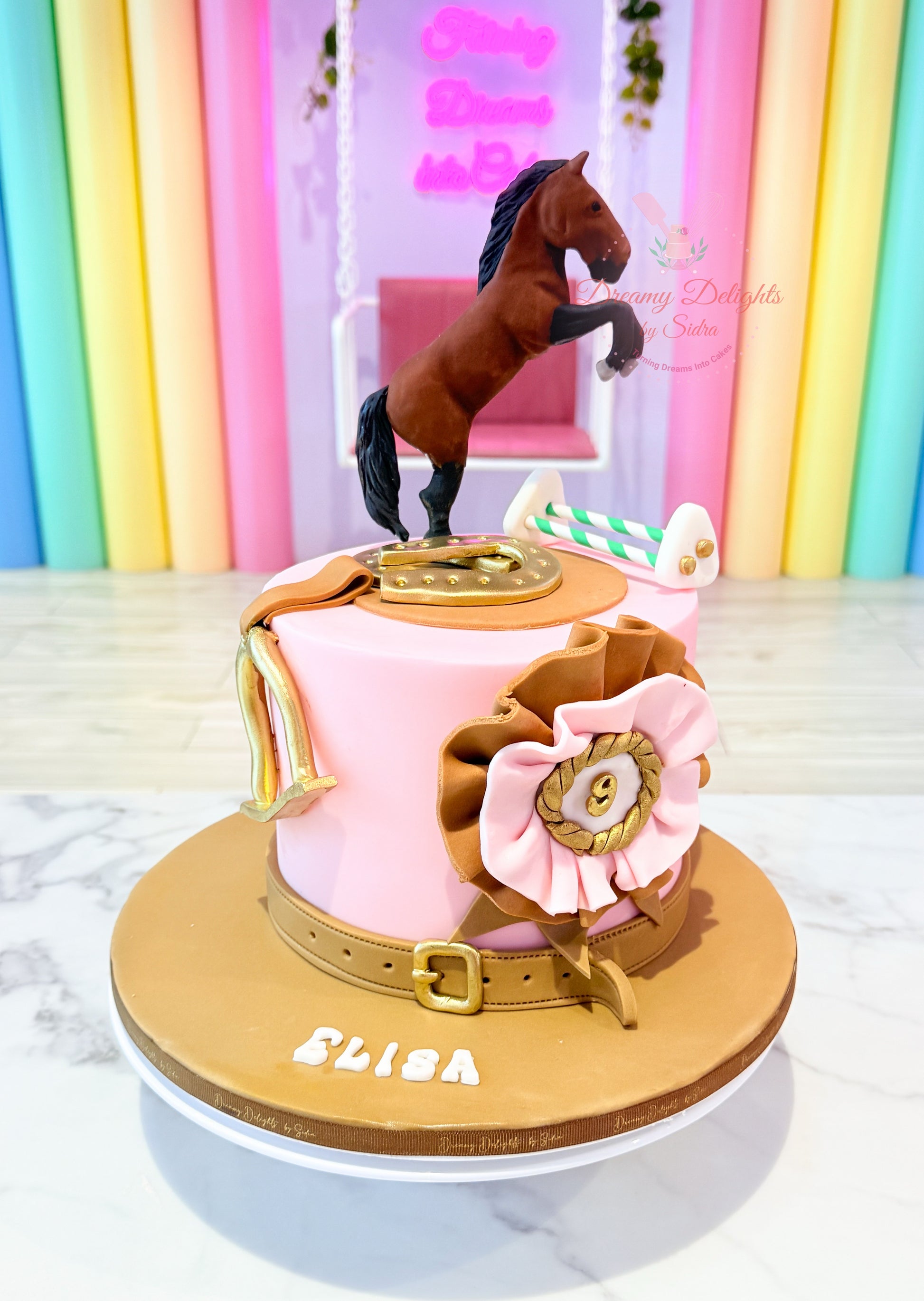 Decorative cake with a horse figure on top, set against a colorful background.