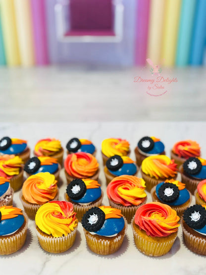 Hot Wheels themed cupcakes with colorful buttercream frosting and racing car toppers for boys' birthday parties in Dubai.