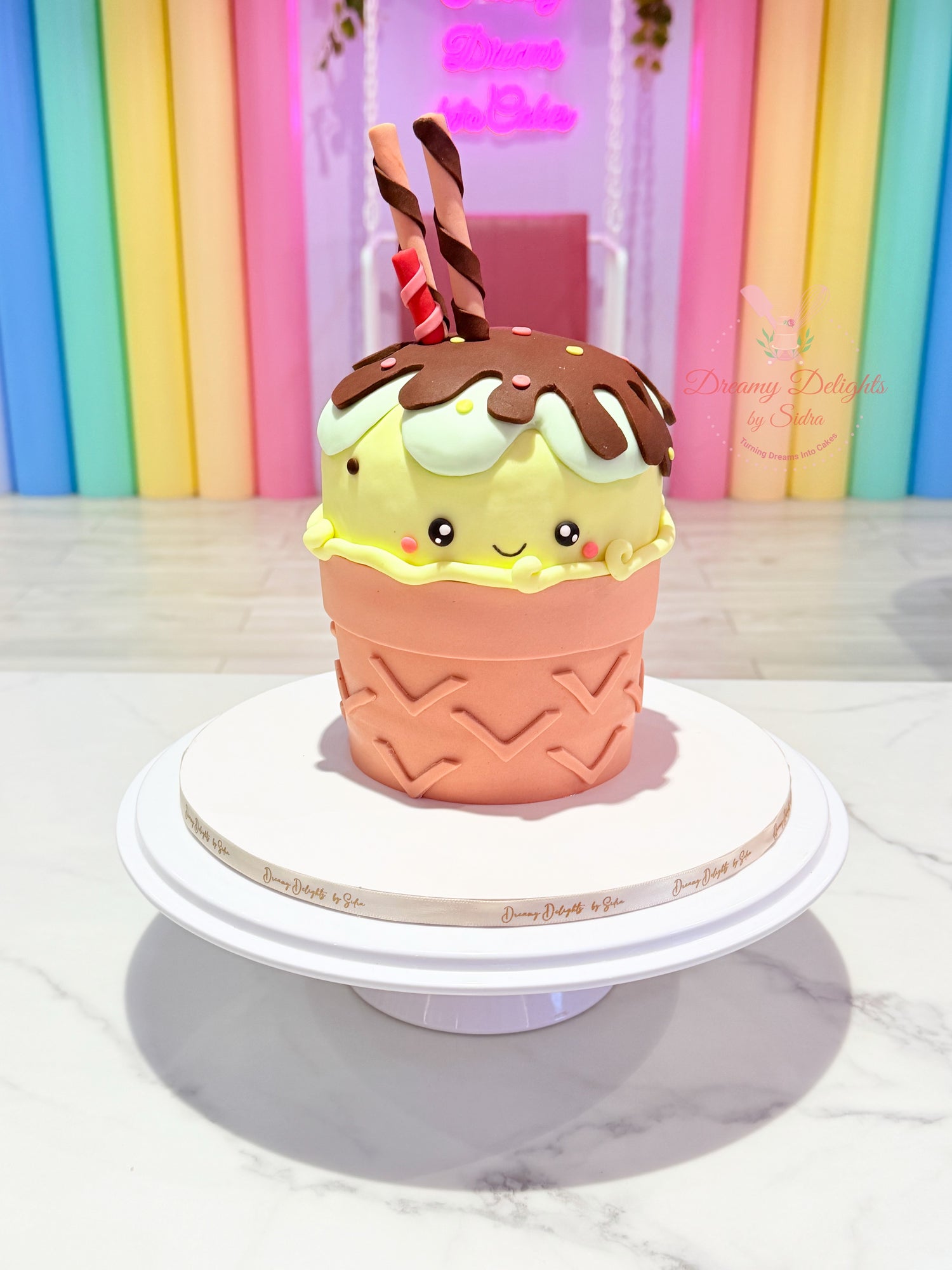 Cute ice cream birthday cake with smiling face and chocolate drip, customized kids birthday cake for girls in Dubai