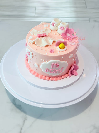 Its a girl baby shoes cake