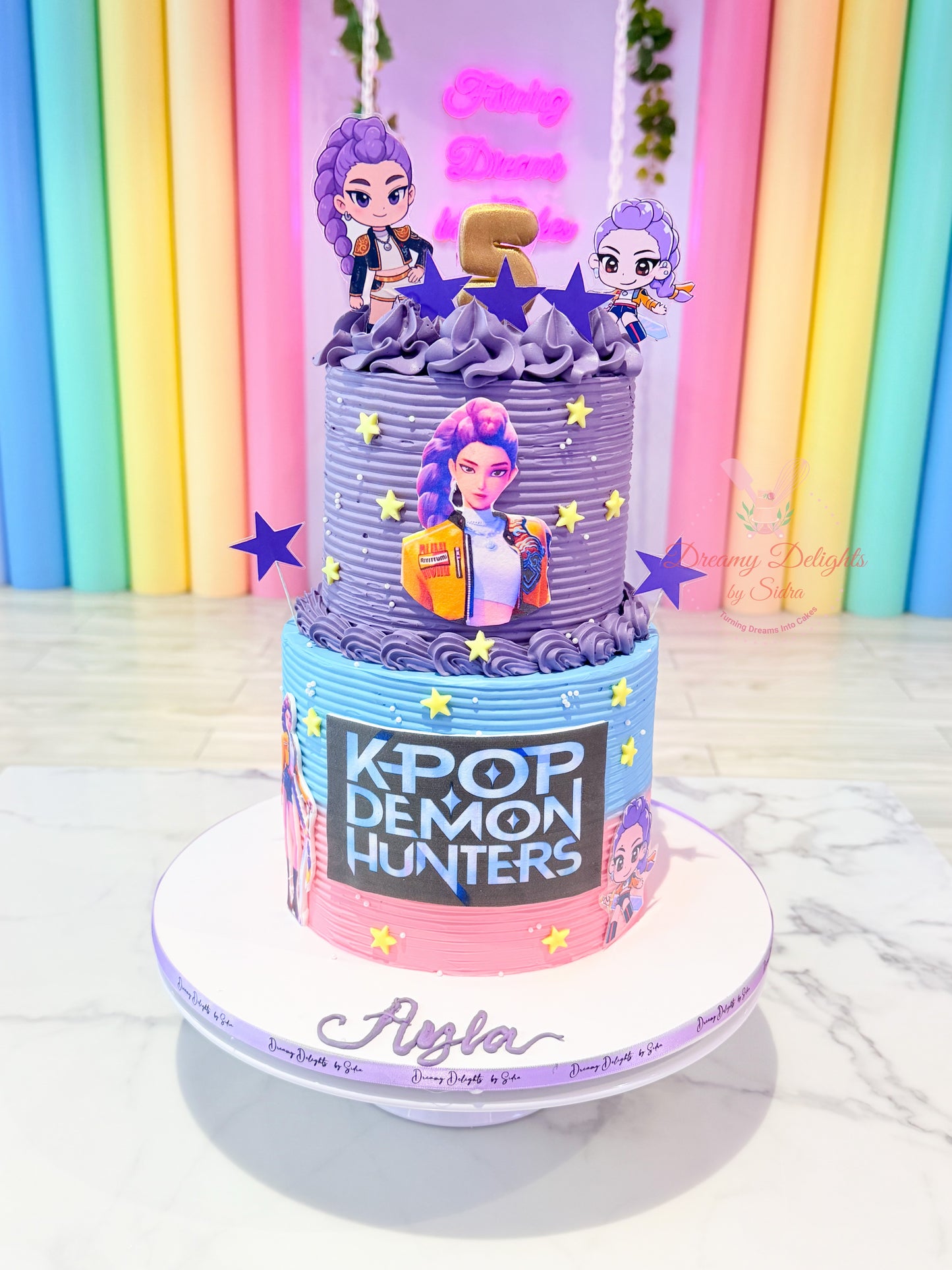 KPop Demon Hunters birthday cake for girls with music theme and character toppers in Dubai