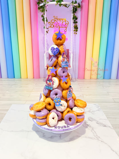 KPop themed donut tower with pastel glazed donuts for kids birthday party