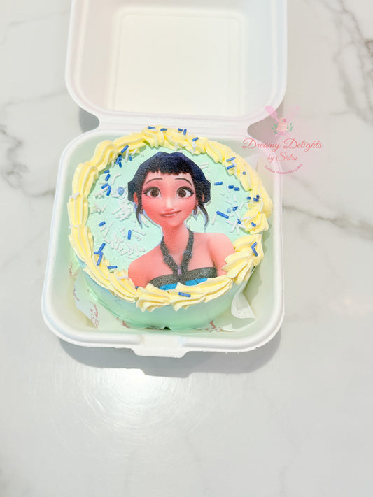 KPop Zoey Bento Cake with mint-green frosting, character image, yellow piped border and blue sprinkles for a girl's birthday