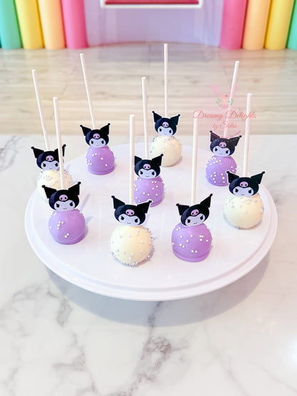 Kuromi themed cake pops with purple and white chocolate coating for birthday parties and celebrations in Dubai.