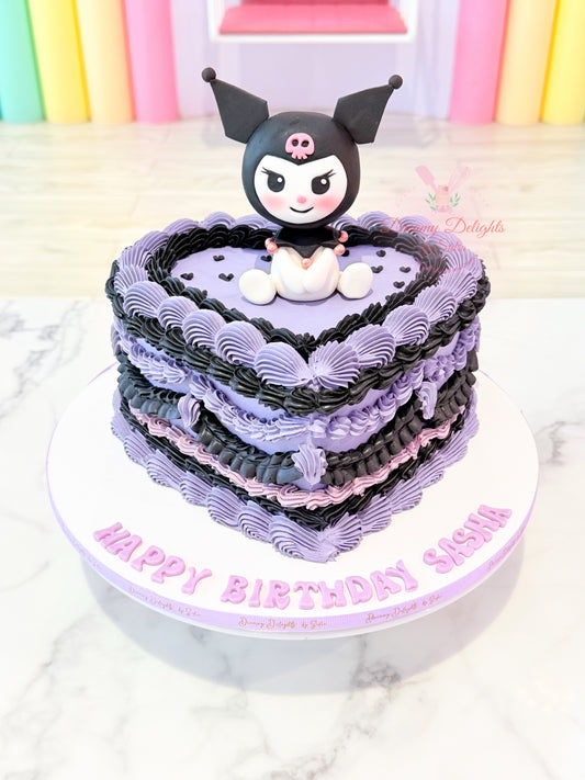 Heart-shaped Kuromi birthday cake with purple and black buttercream piping and handcrafted Sanrio topper for girls in Dubai.