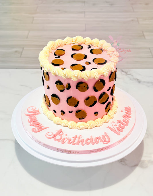 Leopard print vintage cake with pink base and classic piping design for her birthday in Dubai