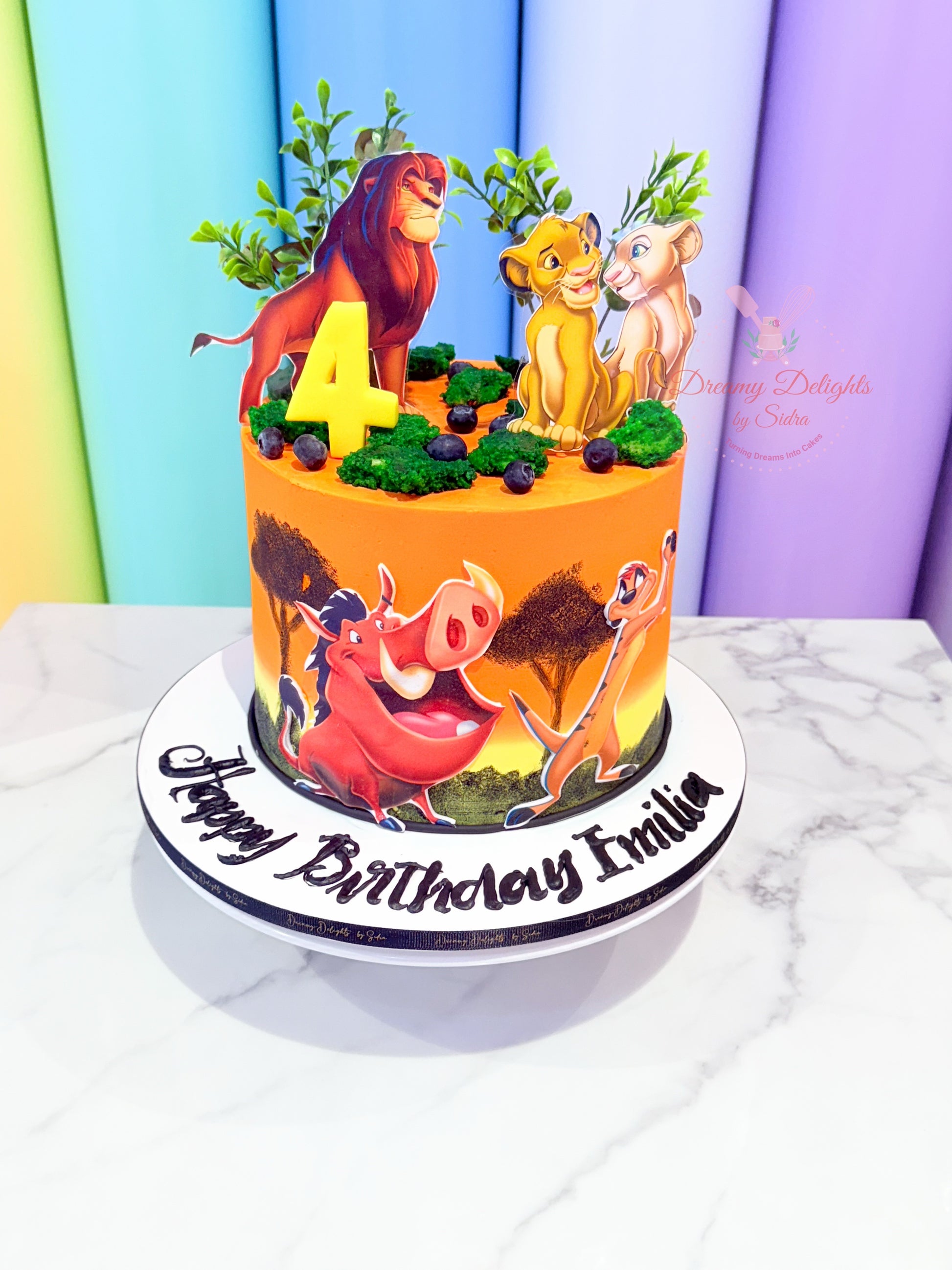 Birthday cake with animated character design on a colorful background