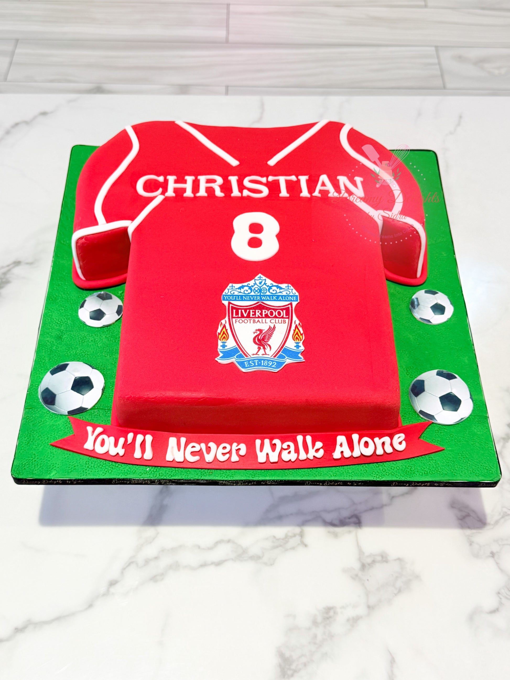 Personalized Liverpool FC jersey birthday cake with custom name, football theme, and jersey number for boys in Dubai.
