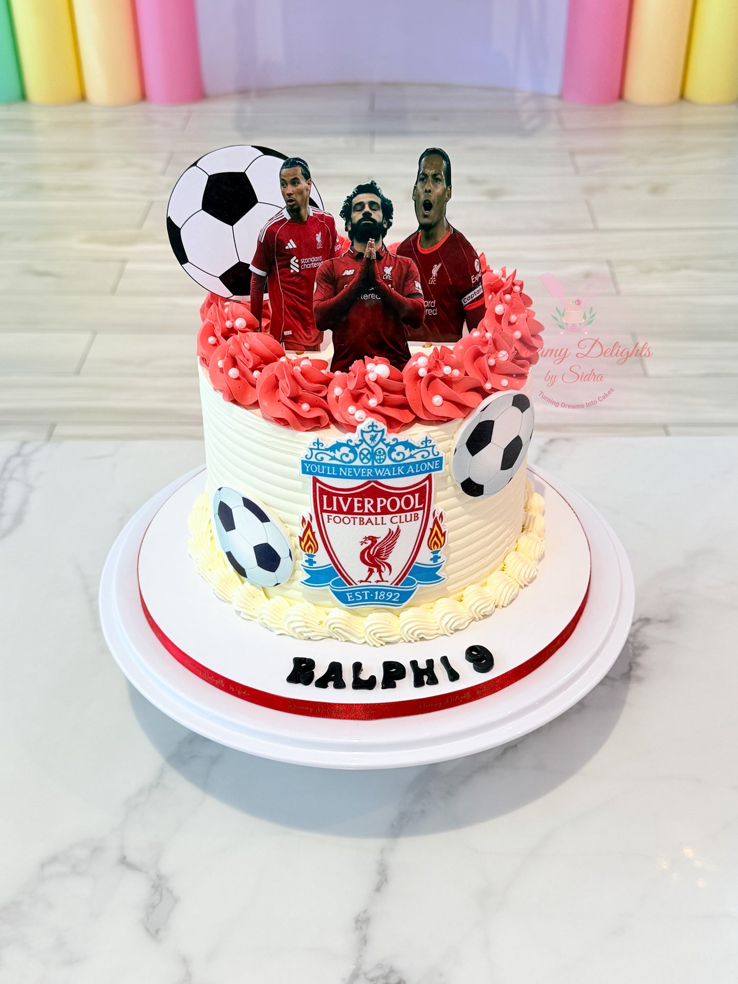 Liverpool football birthday cake with soccer toppers for boys in Dubai