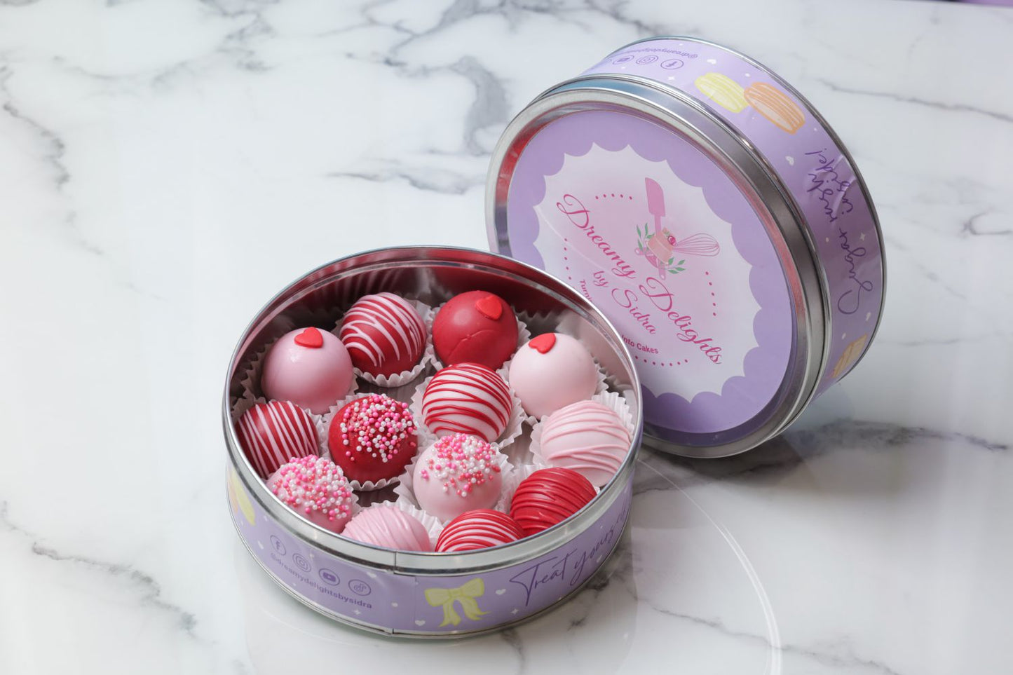 Valentine’s Day cake balls tin with 13 decorated cake balls in pink and red by Dreamy Delight by Sidra