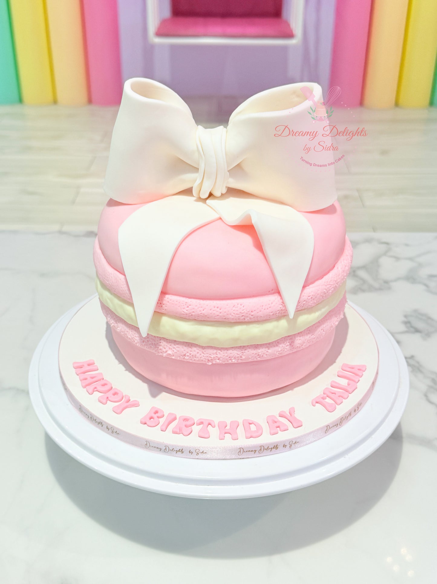Macaron big bow cake in Dubai girls birthday custom kids celebration cake