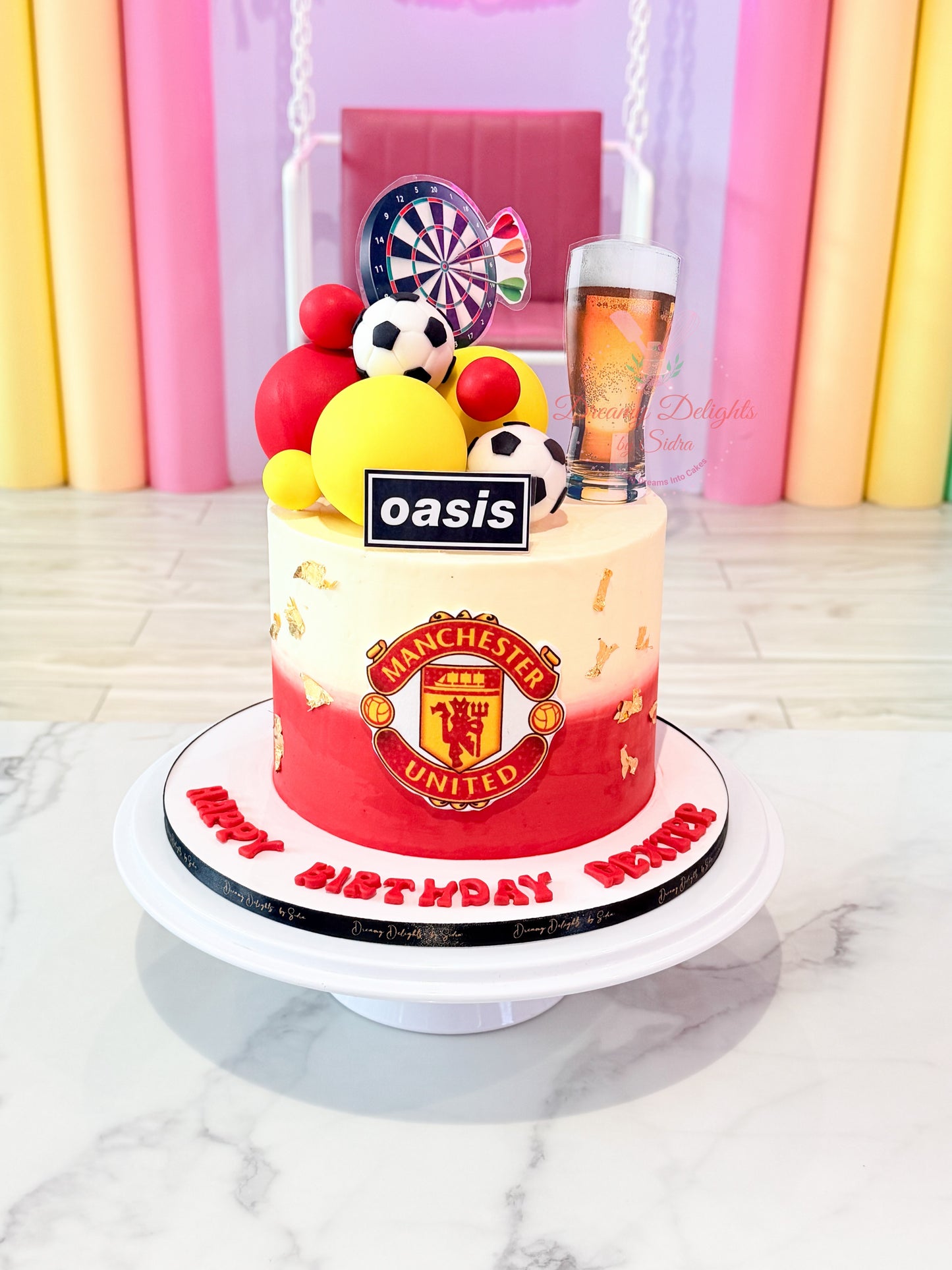 Manchester United football birthday cake for him with football decorations and hobby-themed design handcrafted by Dreamy Delights by Sidra in Dubai.