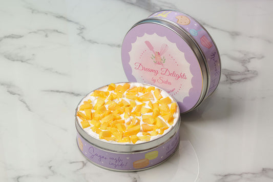 Mango tiramisu tin with fresh mango chunks layered mascarpone dessert in decorative tin Dubai