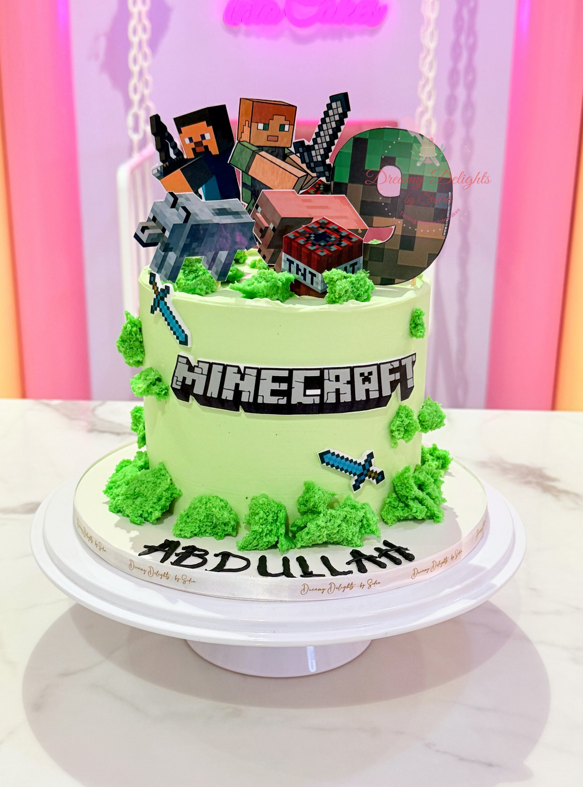 Minecraft cake for boys with gaming theme, pixel-style characters, green grass buttercream finish, and kids birthday celebration design