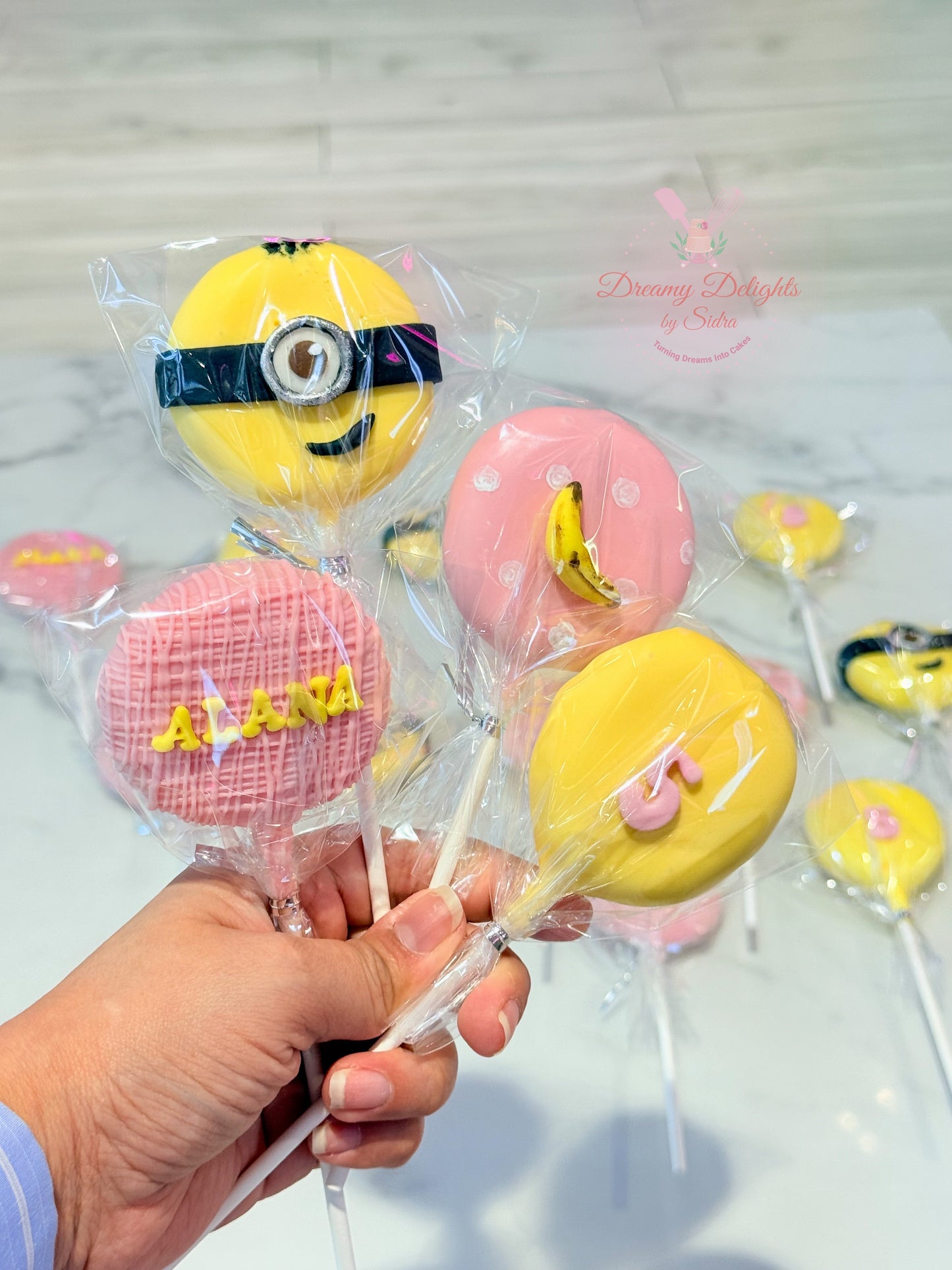 Handcrafted Minions cakepops for kids birthday party dessert table in Dubai