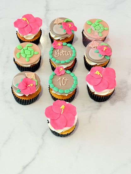 Moana themed birthday cupcakes with hibiscus flower and turtle fondant toppers in Dubai