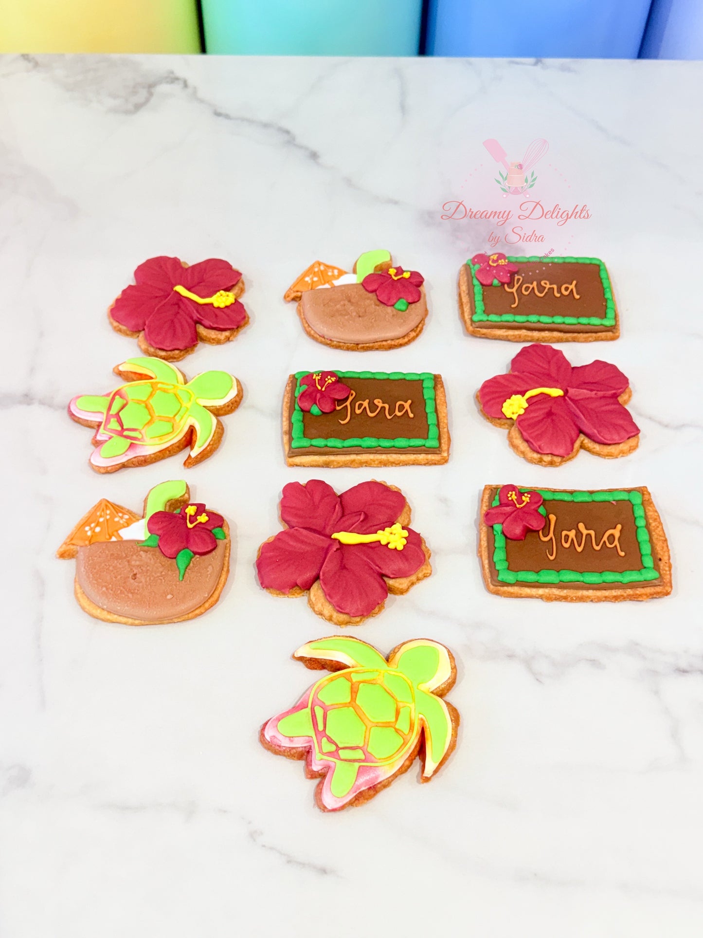Moana themed cookies with hibiscus flower and sea turtle designs for kids birthday party Dubai