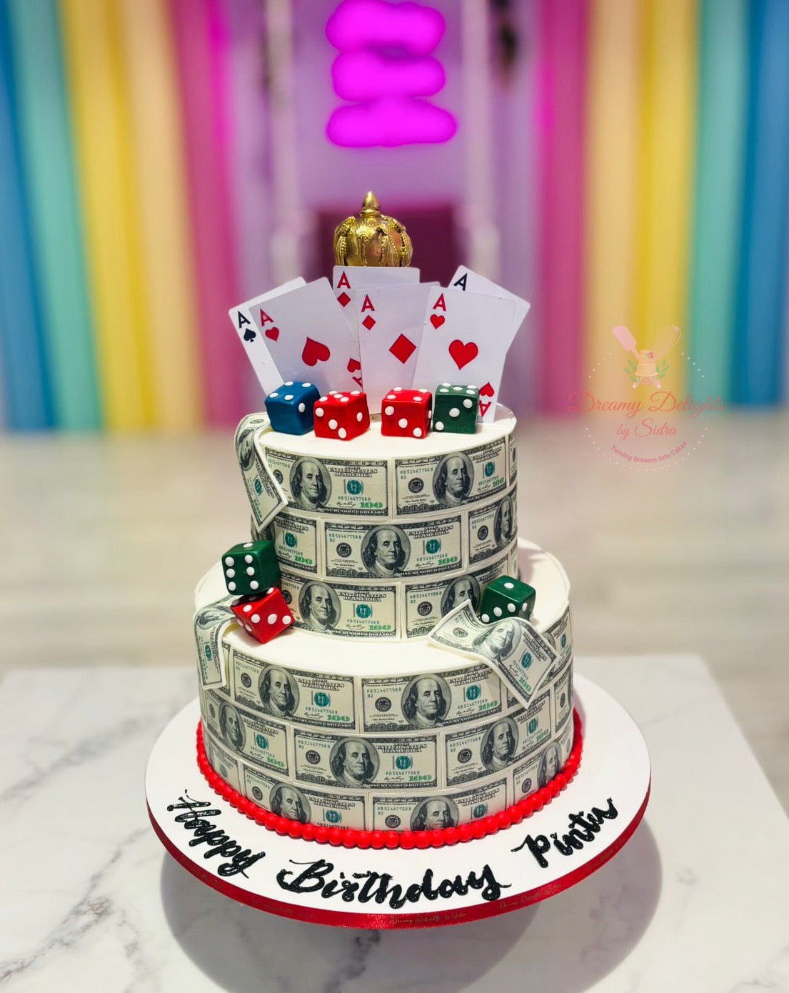 Two tier Money and Cards themed custom birthday cake with edible currency wrap, dice, and playing cards in Dubai