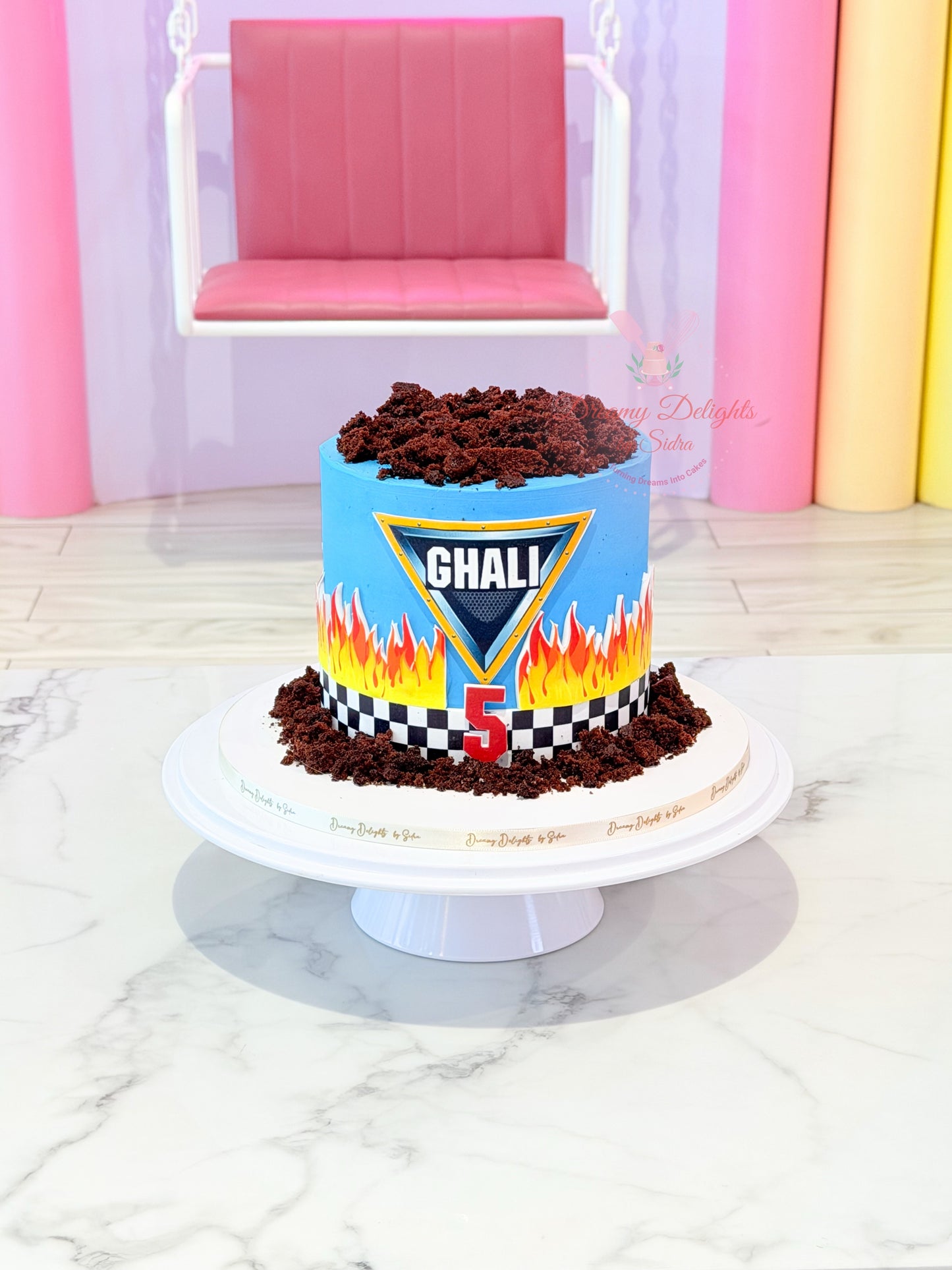 Monster Truck Birthday Cake Dubai for boys featuring racing theme design, flames decoration, and customized kids birthday cake style.