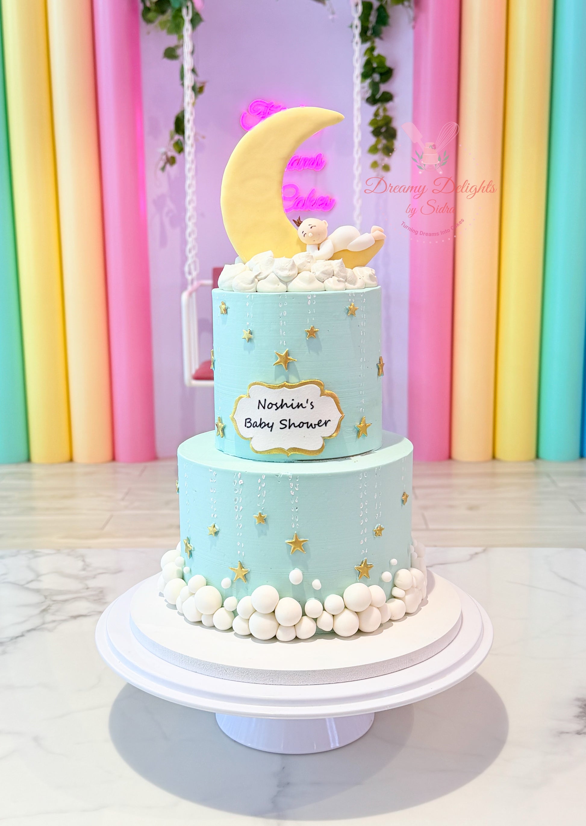moon baby shower cake Dubai with sleeping baby topper and stars