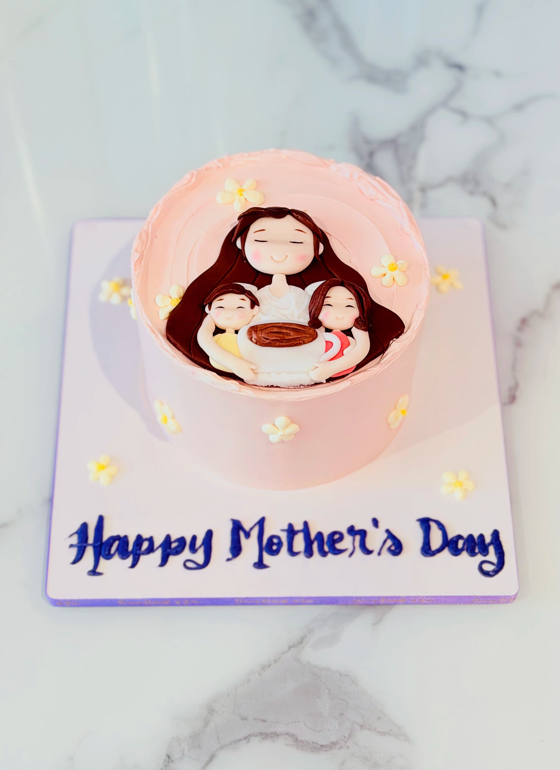 Mother’s Day cake with mother and kids fondant design in Dubai