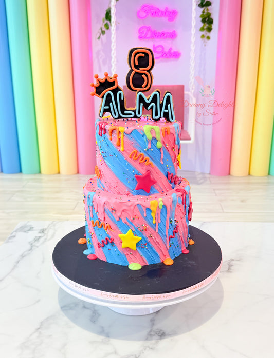 Colorful neon drip birthday cake with personalized name topper, stars, and vibrant buttercream design for girls in Dubai.
