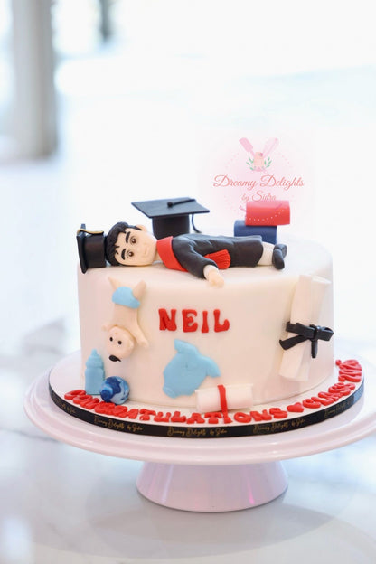 New Dad Graduation Cake Dubai with graduate figure, baby details, diploma decoration, and customized celebration cake design.
