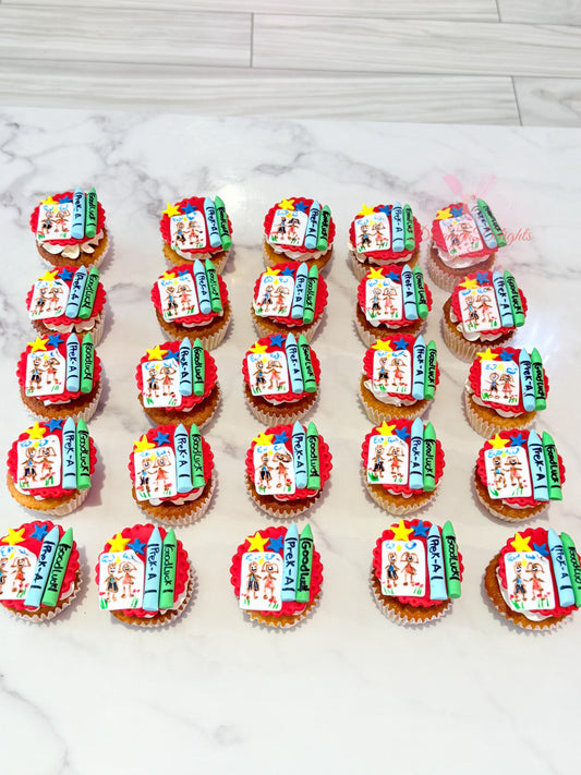 Decorative cupcakes with colorful designs on a marble surface