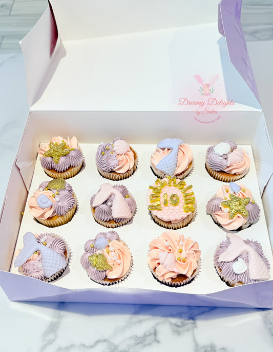 Pastel mermaid cupcakes with seashells, pearls and mermaid tails