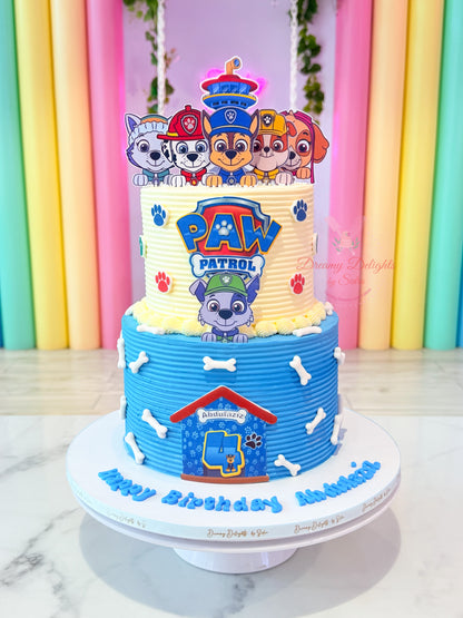 Paw Patrol themed kids birthday cake for boys with colorful cartoon characters and bone accents in Dubai