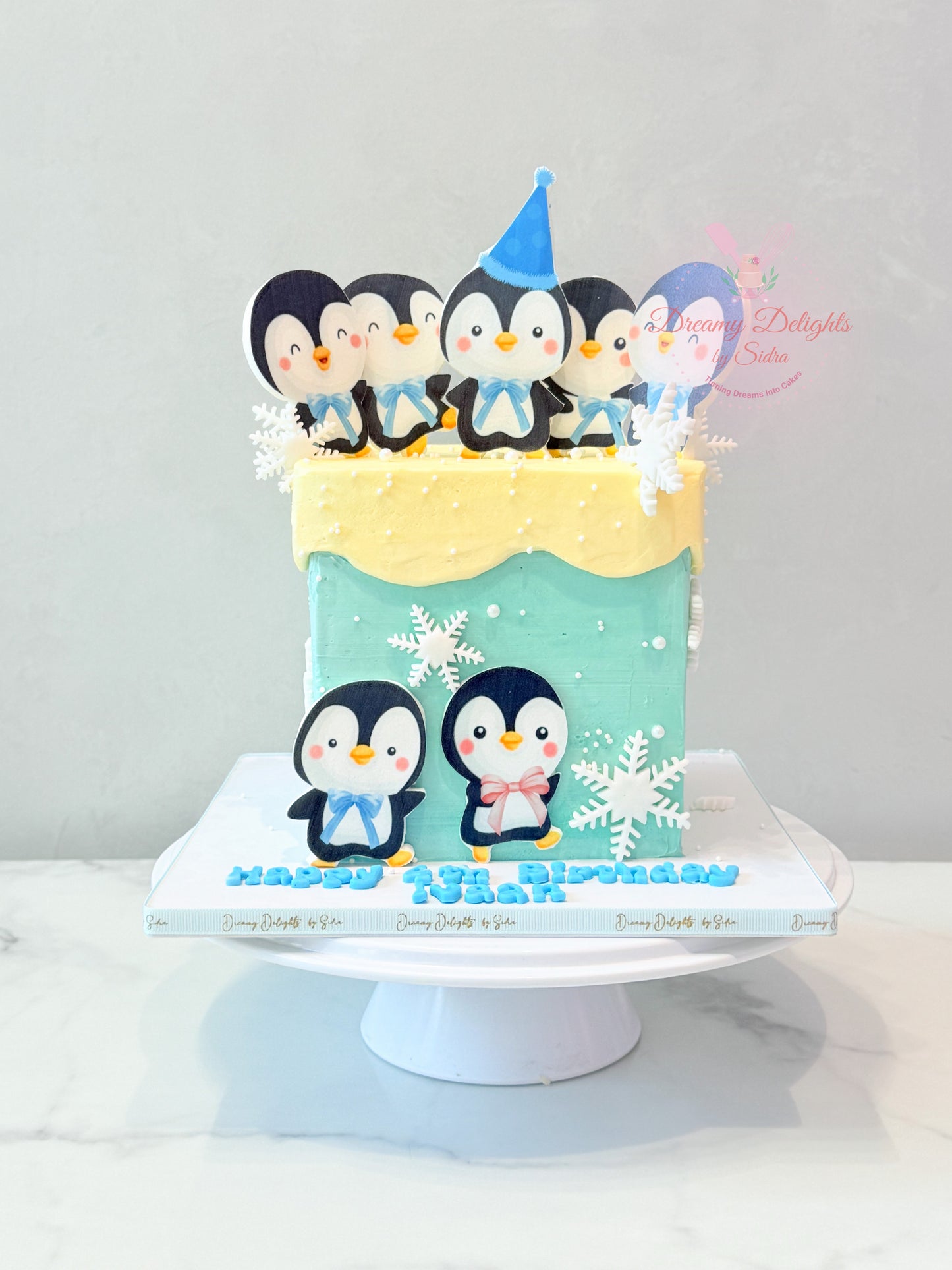 Penguin cake with cute penguin theme kids birthday cake for boys in Dubai