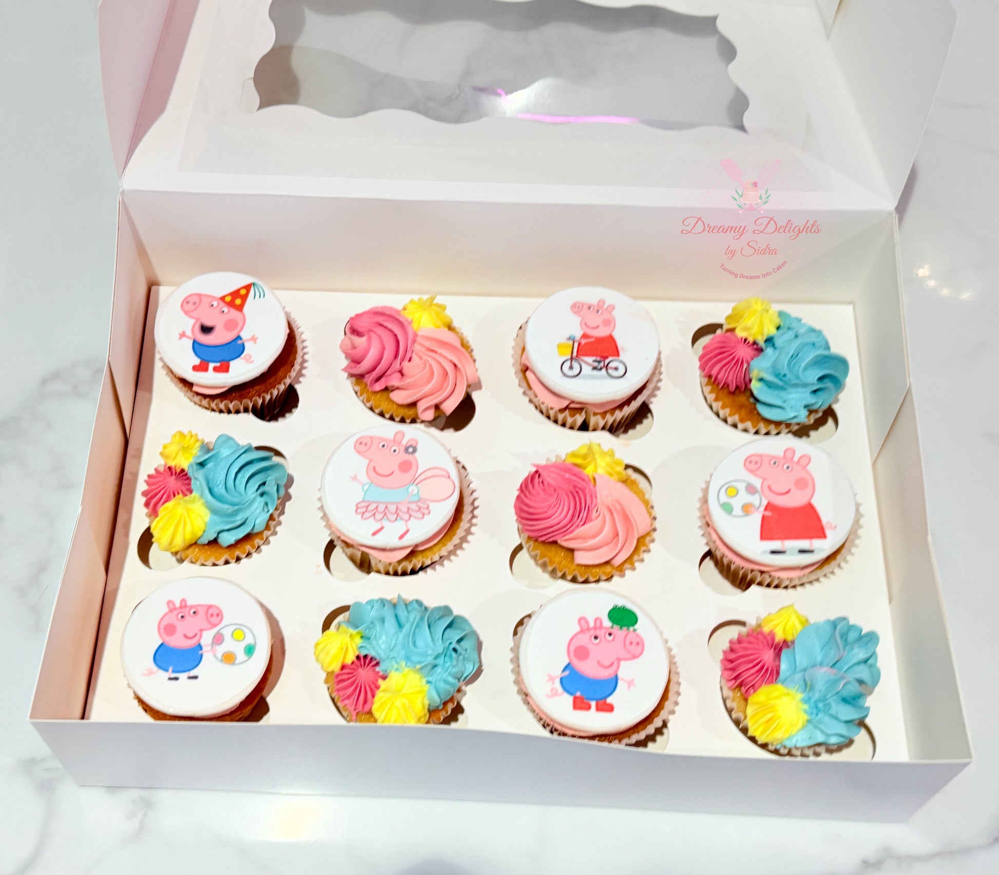 Peppa Pig Cupcakes with cartoon toppers and colorful buttercream for girls birthday parties in Dubai