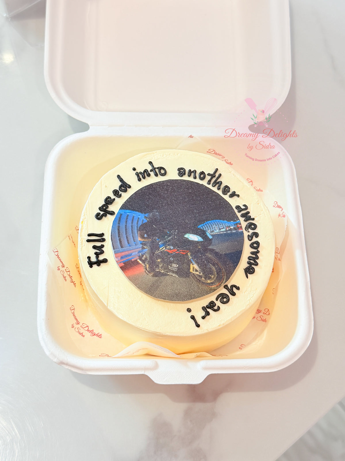 Personalised photo bento cake Dubai with a custom motorcycle photo and message by Dreamy Delights by Sidra