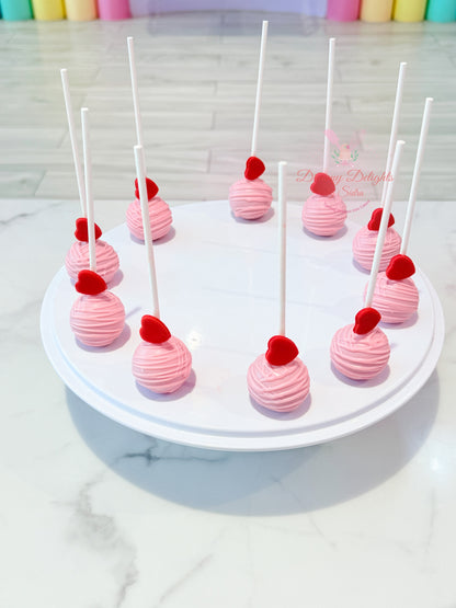 Pink heart cake pops with edible heart toppers for birthdays, baby showers, Valentine's Day and celebrations in Dubai.