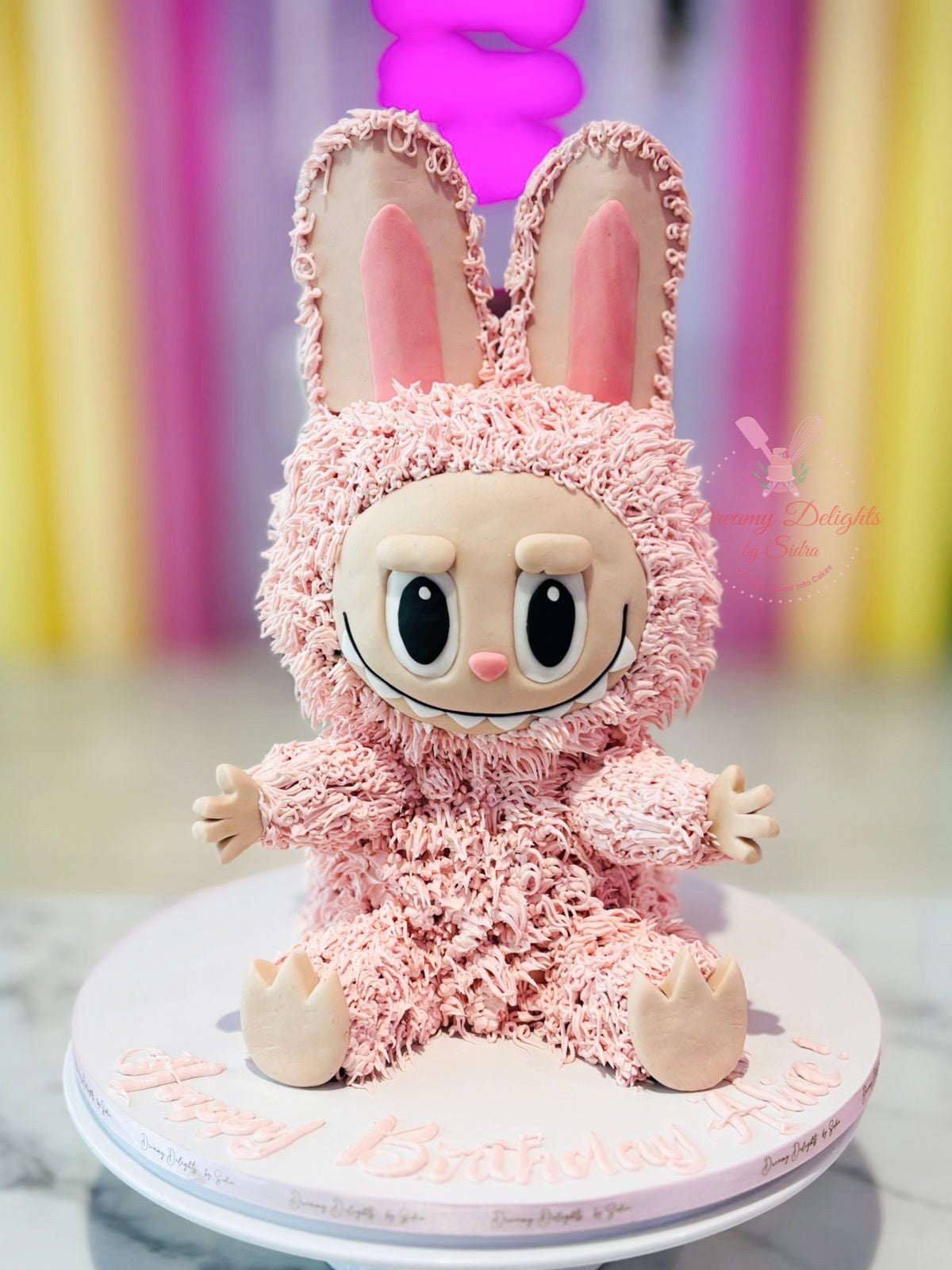 Pink Labubu birthday cake for girls with cute character design and custom detailing in Dubai
