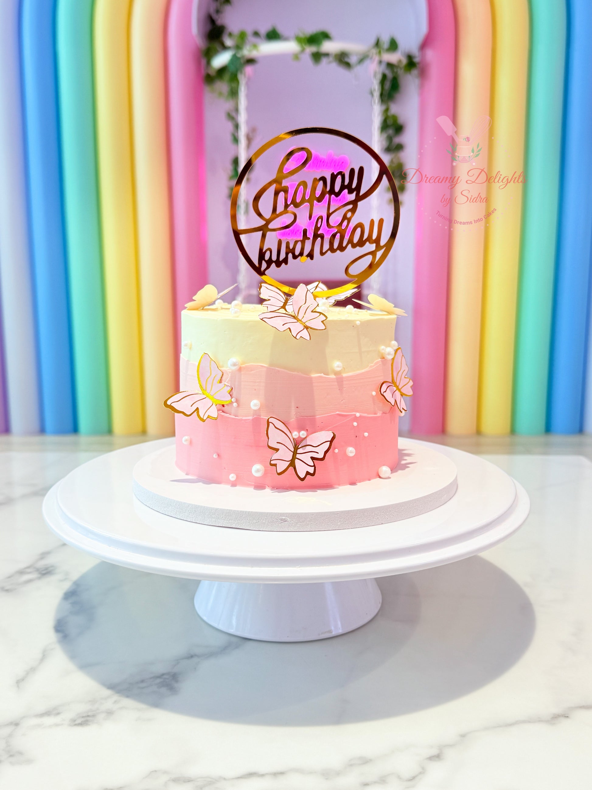 Pink ombre butterfly birthday cake for girls with elegant pastel design in Dubai